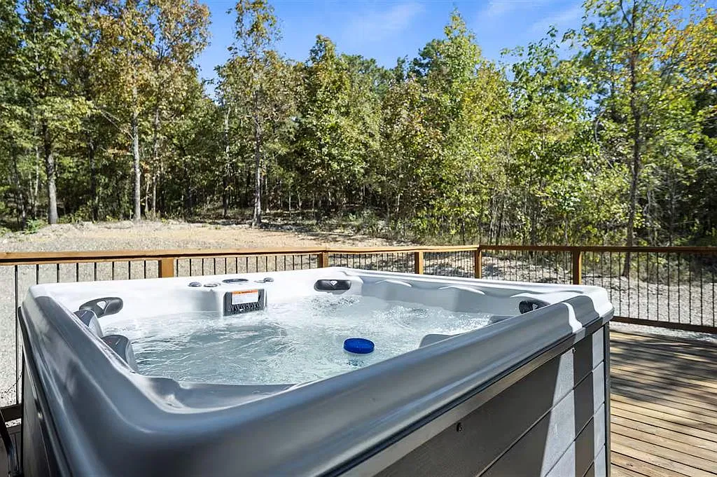 Private hot tub on the deck overlooking the woods